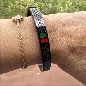 Black and Silver Patterned Bracelet with Red and Green Accents